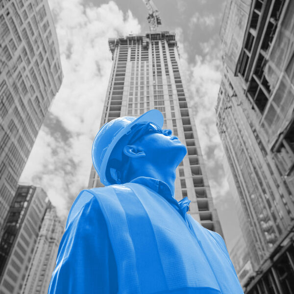 Construction Engineer Observing Skyscraper Development Site. Mod